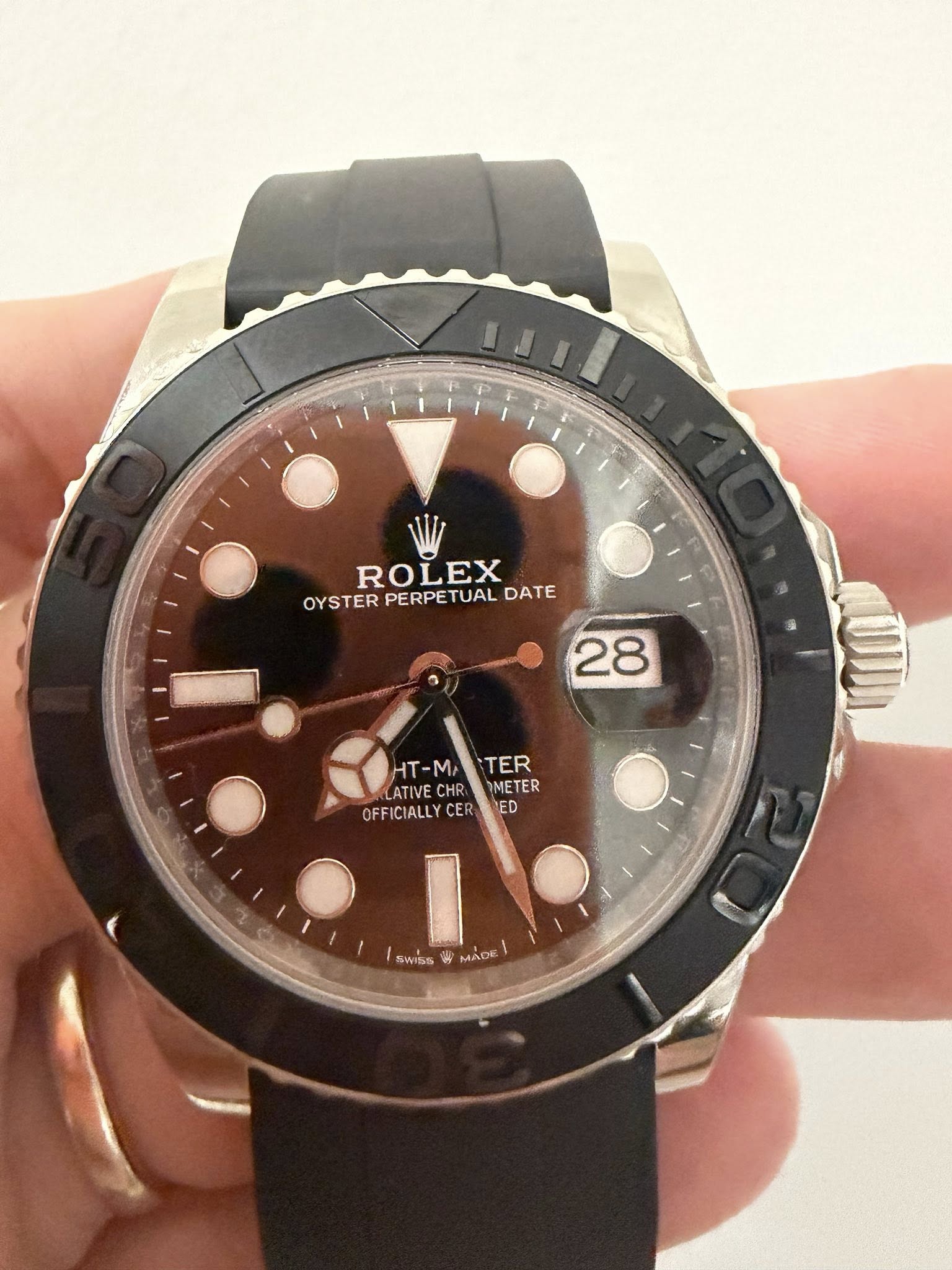 May be an image of wrist watch and text that says 'ROLEX OYSTER PERPE OYSTERPERPETUALDATE PERPETUAL TUAL DATE 28 HT-M HT-M TER LATIVE CHR METER HT-MATER TER ER OFFICIALLY…