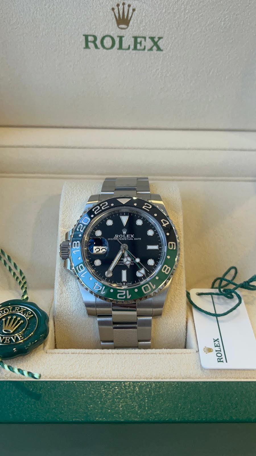 May be an image of wrist watch and text that says 'ROLEX ROLEX OLE O ) 4 C 80 10 ROLEX'