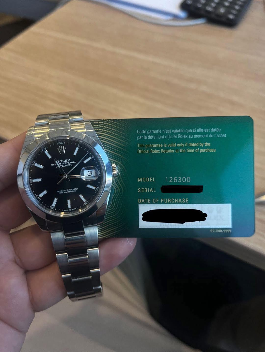 May be an image of wrist watch and text