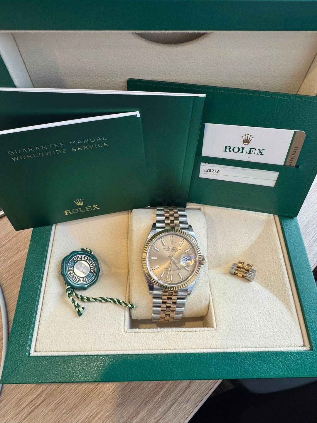 May be an image of wrist watch and text that says 'MANUAL SERVICE ROLEX 126233 い た SUPERLATE SUPERE SUERENI SUPER KEPIED 1S13 ١ 29 T ונים SI'
