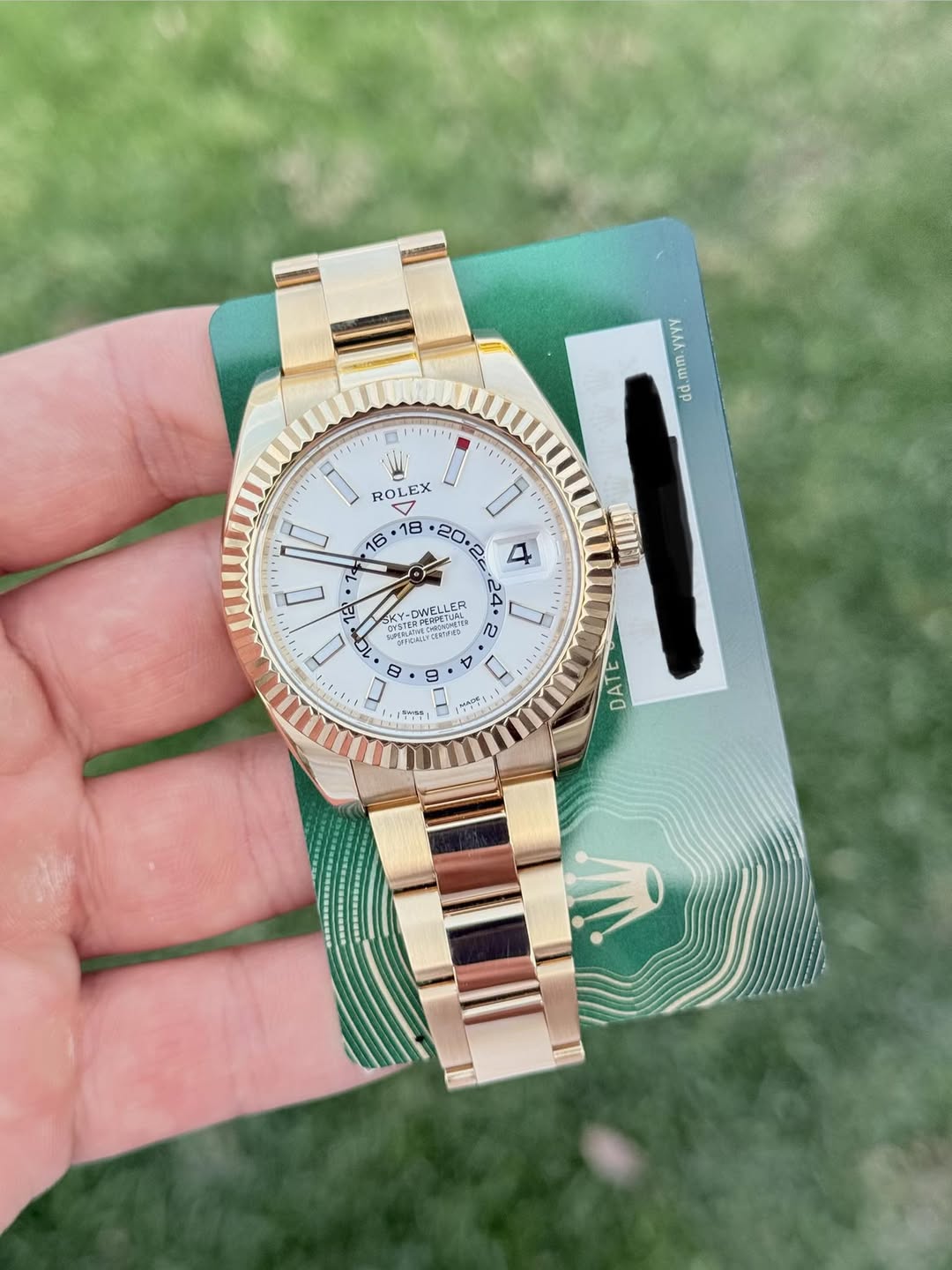 May be an image of wrist watch and text