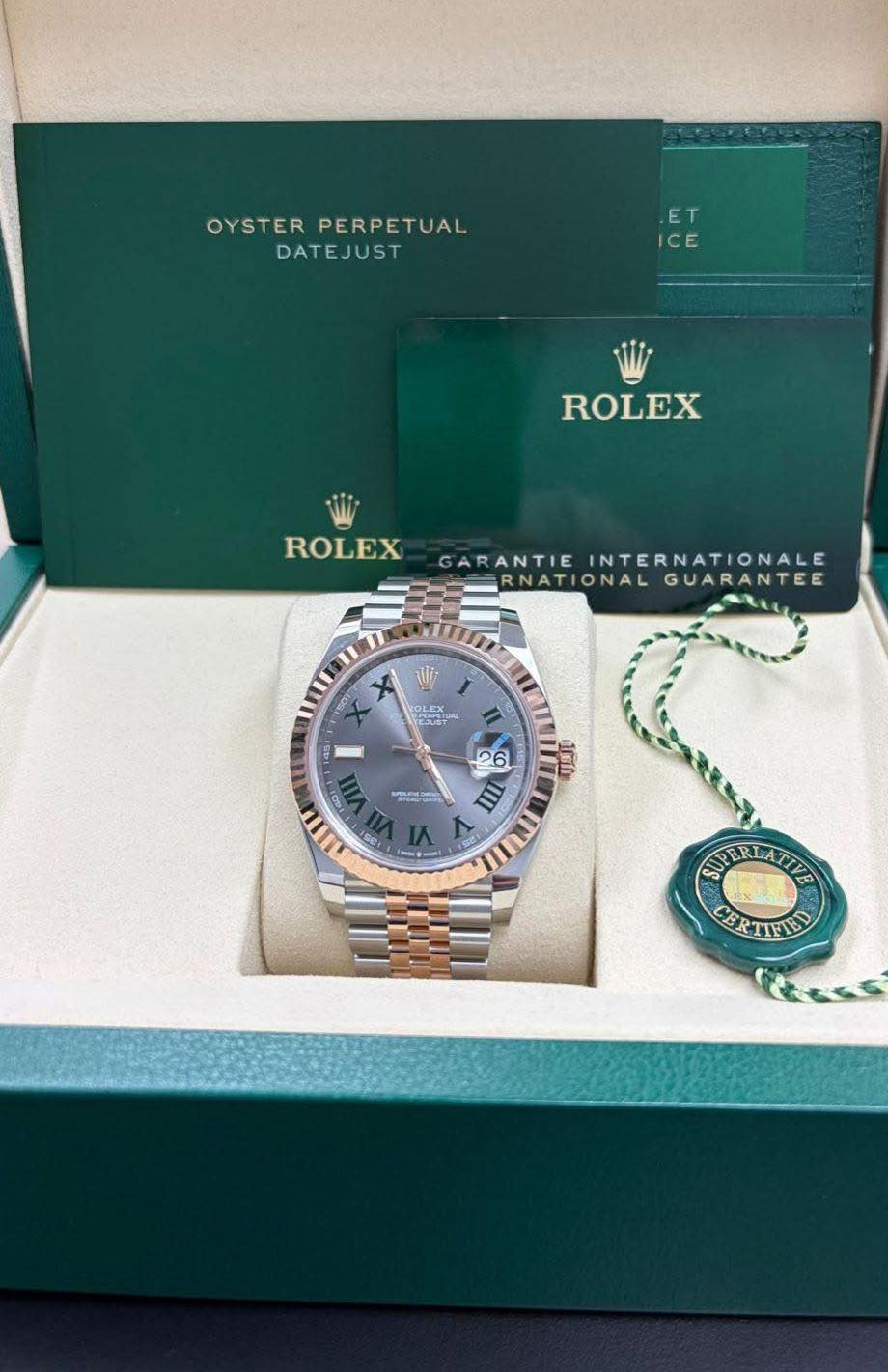 May be an image of wrist watch and text that says 'OYSTER STERPERPETUAL PERPETUAL DATEJUST ET T ICE ROLEX ROLEX GARANTIEINTERNATIONALE GARANTIE INTERNATIONALE RNATIONAL…