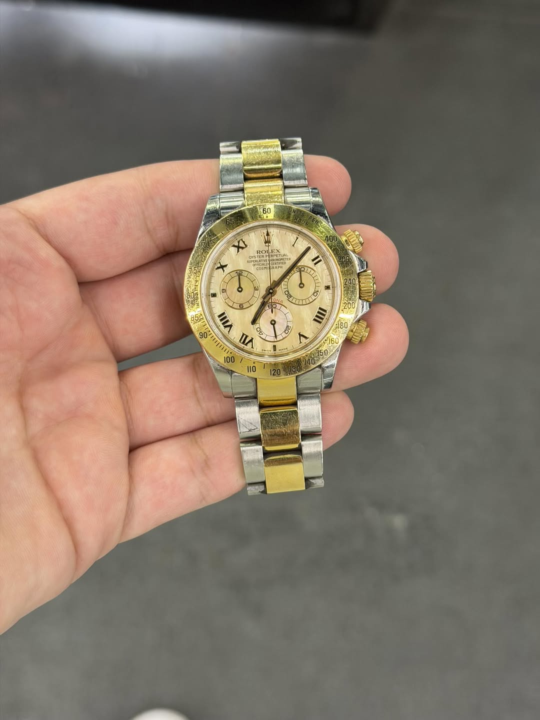 May be an image of wrist watch and text
