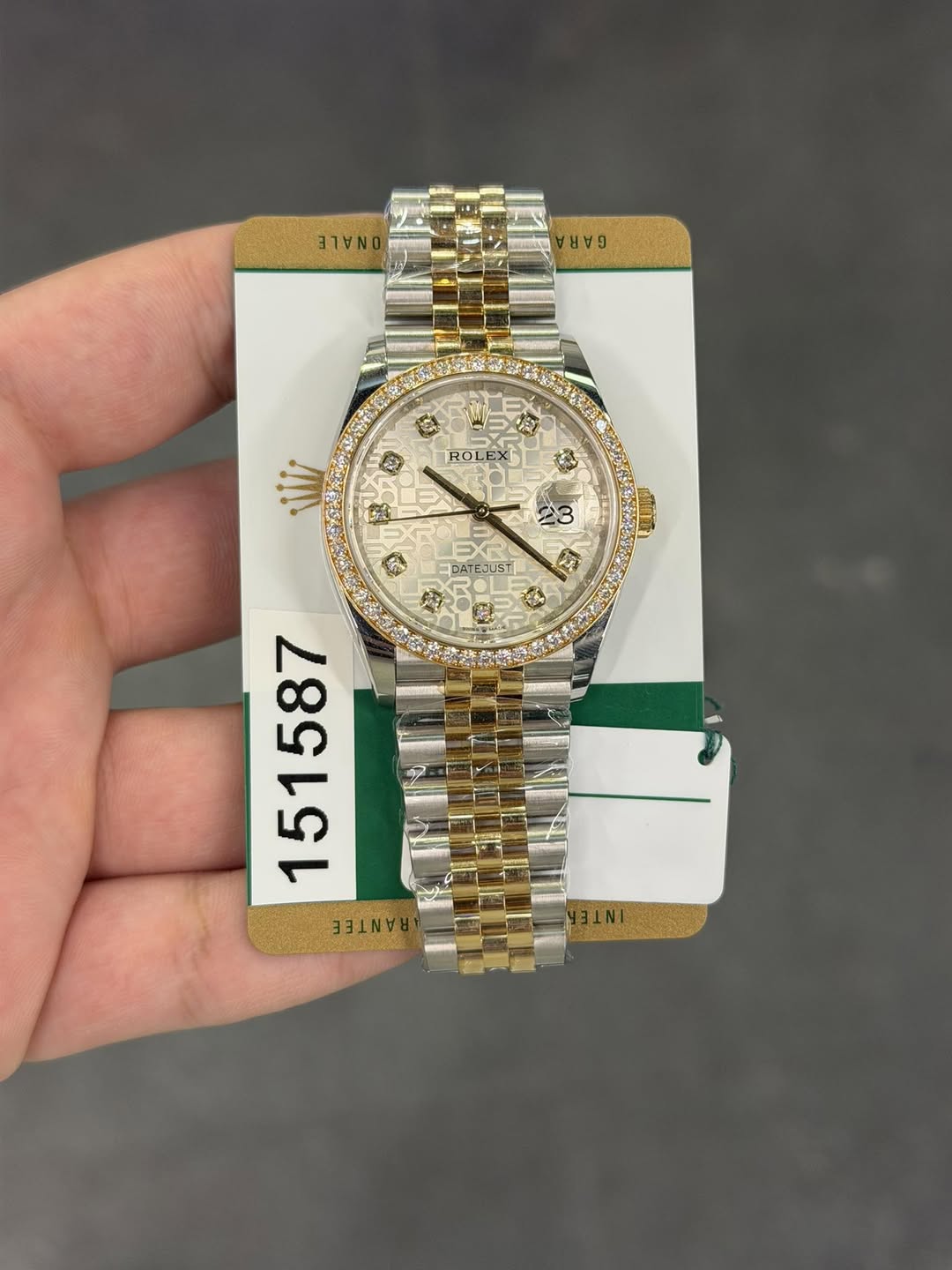 May be an image of wrist watch and text
