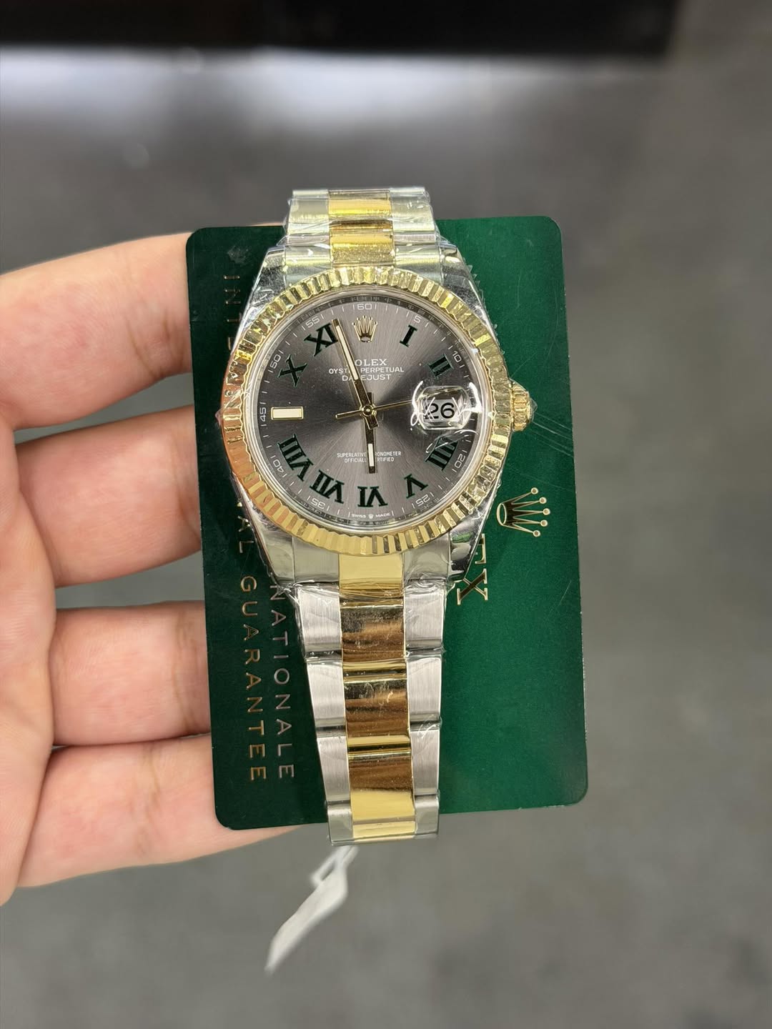 May be an image of wrist watch and text