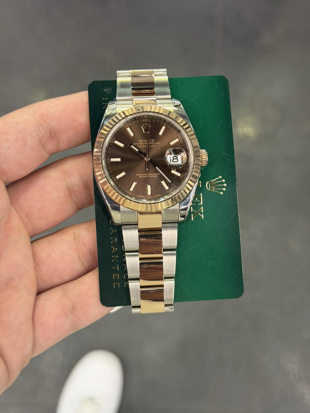 May be an image of wrist watch and text