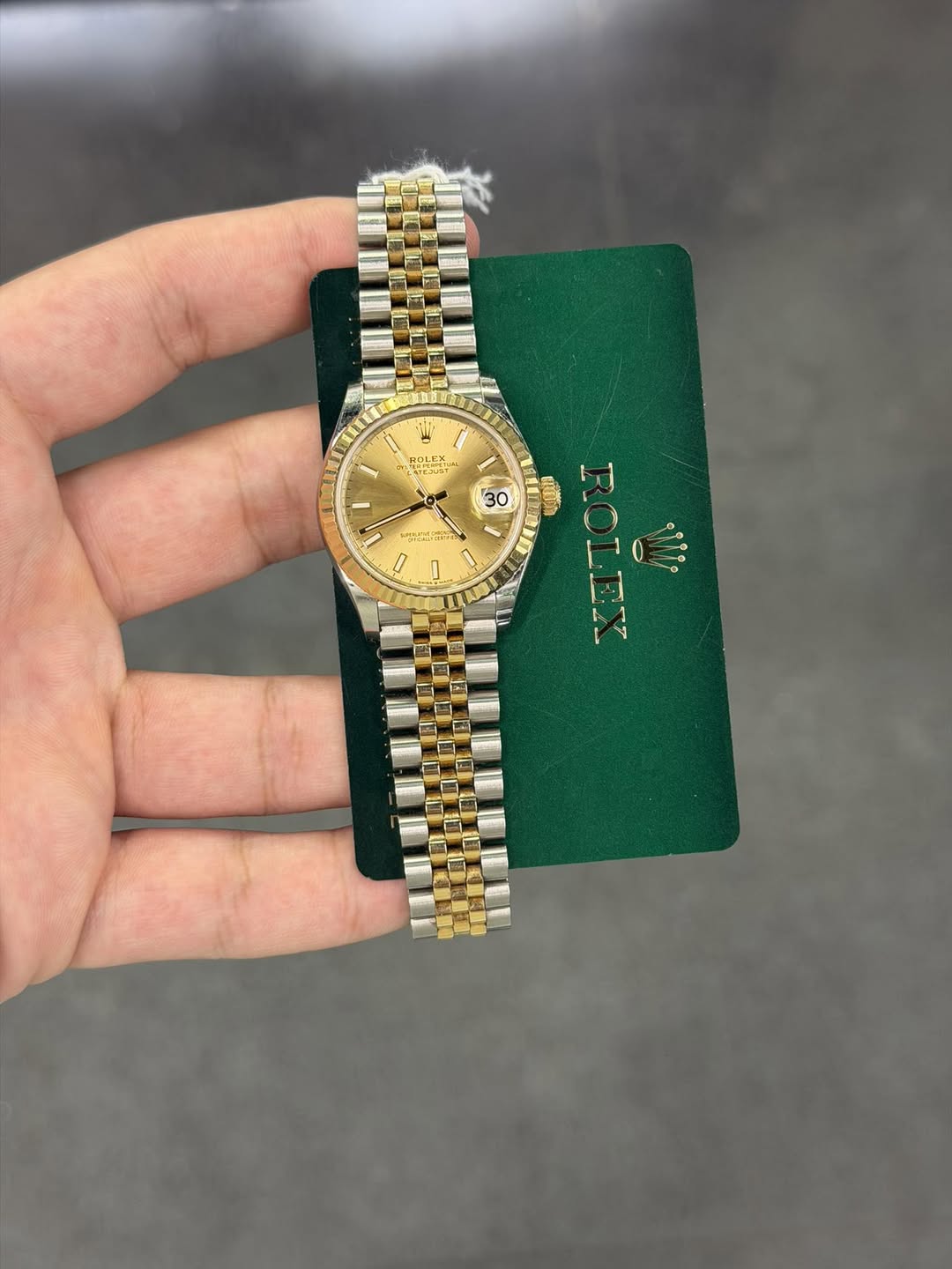 May be an image of wrist watch and text