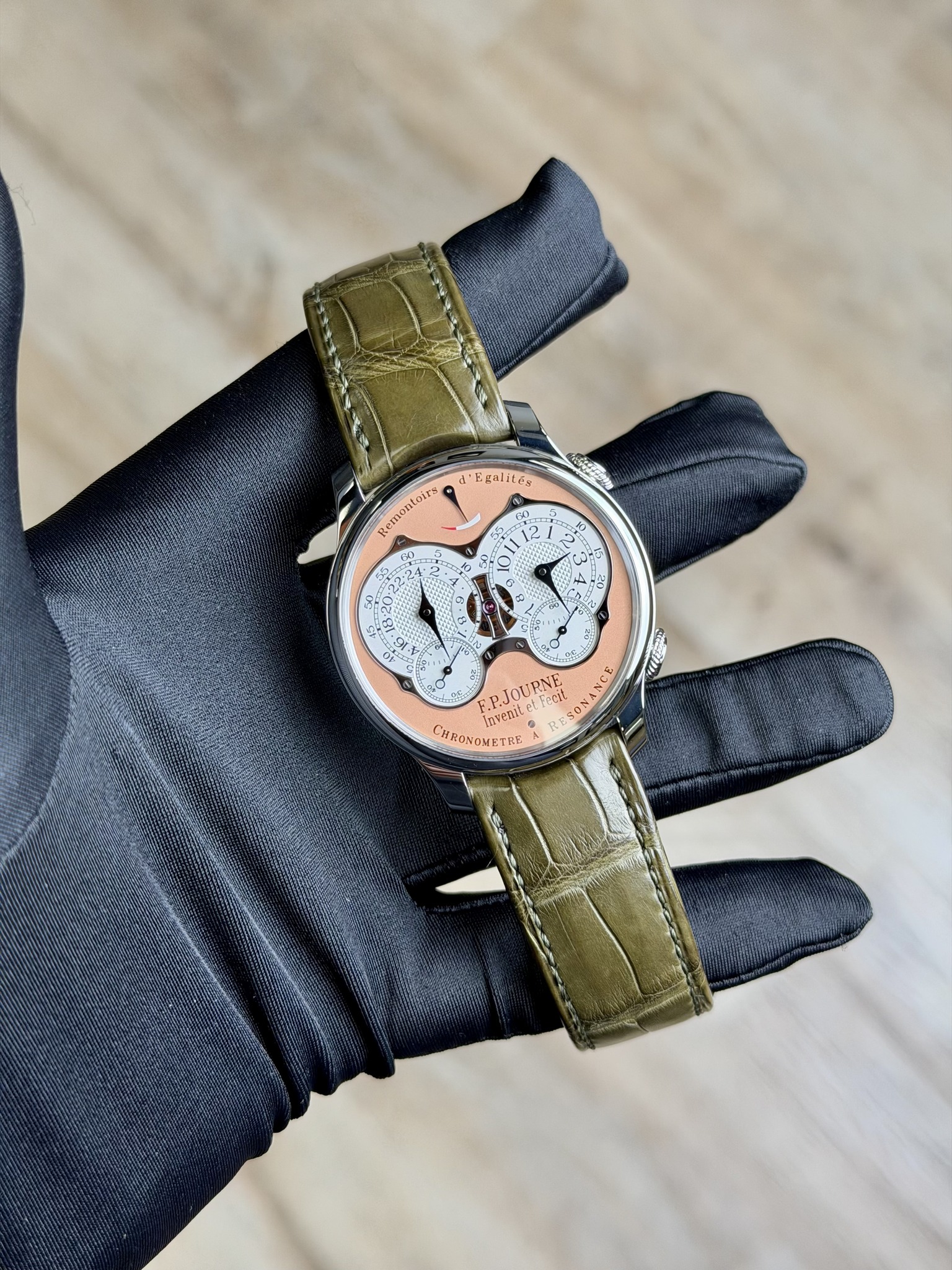 May be an image of leather, wrist watch and text