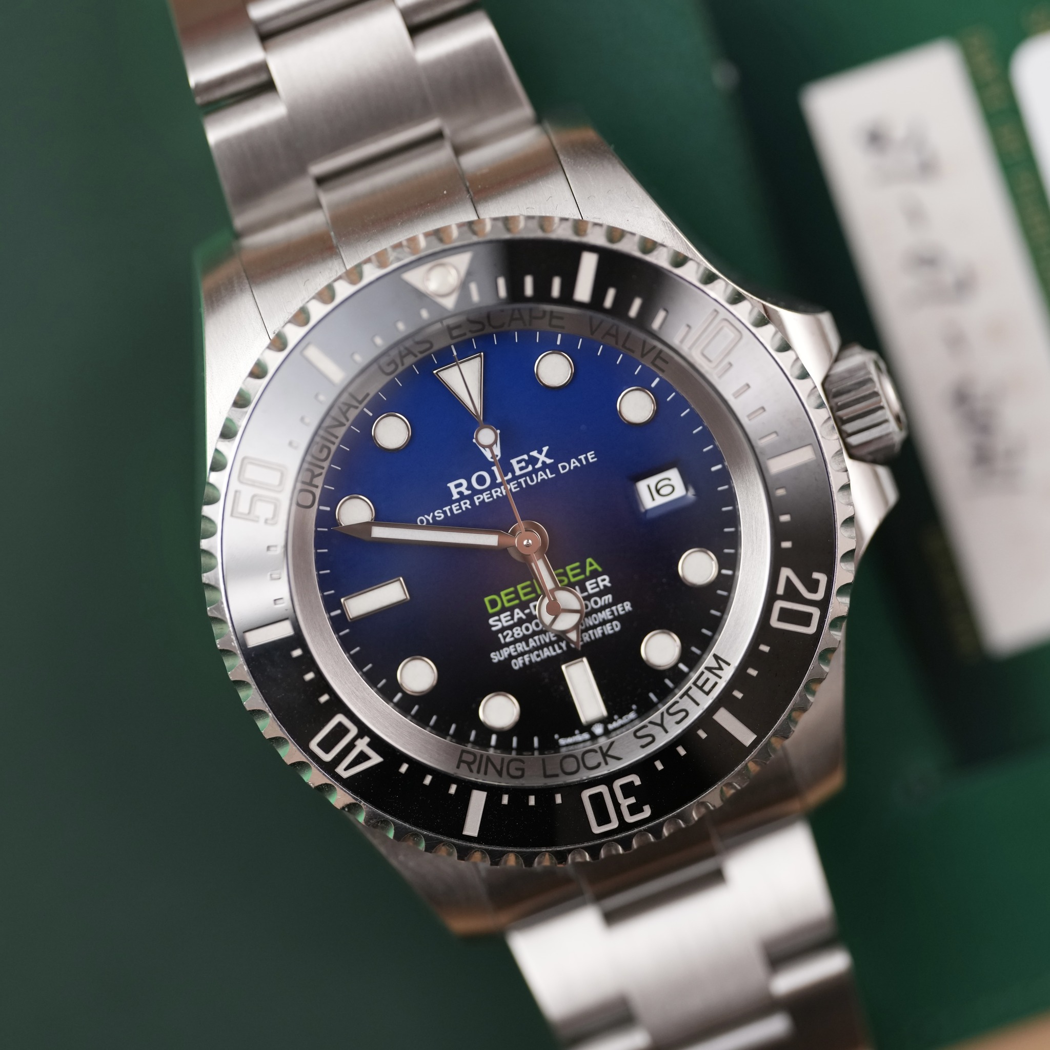 May be an image of wrist watch and text that says '10 50 ORIGI ل ROLEX EX DATE PERPETUAL PERI OYSTER 16 E DEEI DE DEEILE LER SEA SEA-D 00m NOMETER METEL Om 12800 SA PERLATIVE…
