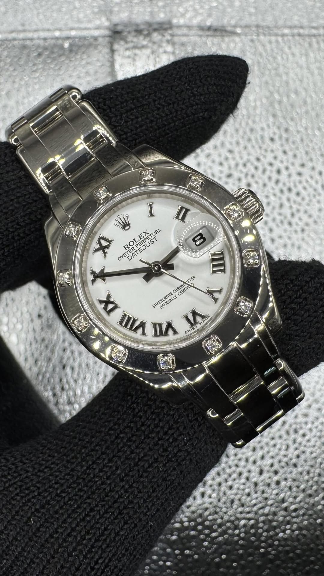 May be an image of wrist watch and text