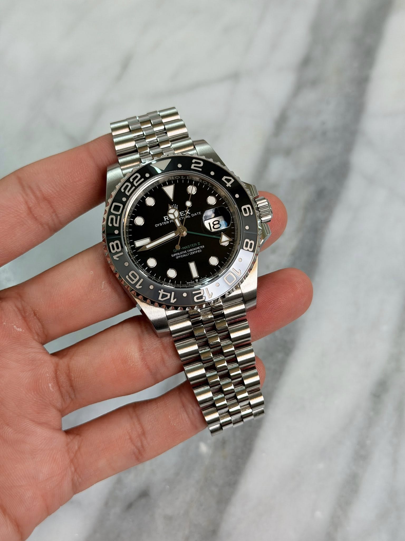 May be an image of wrist watch and text