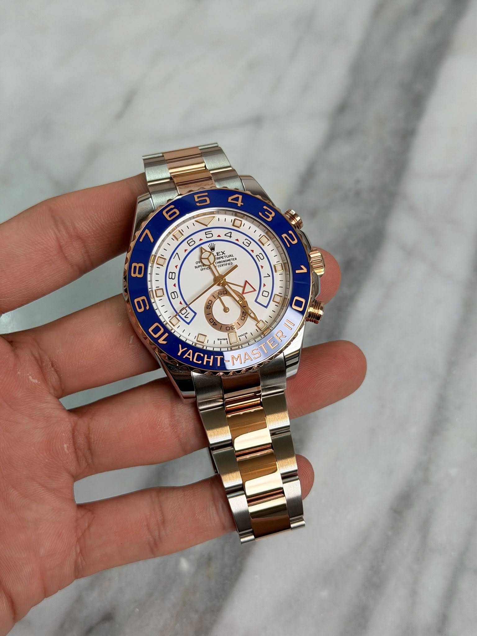 May be an image of wrist watch and text