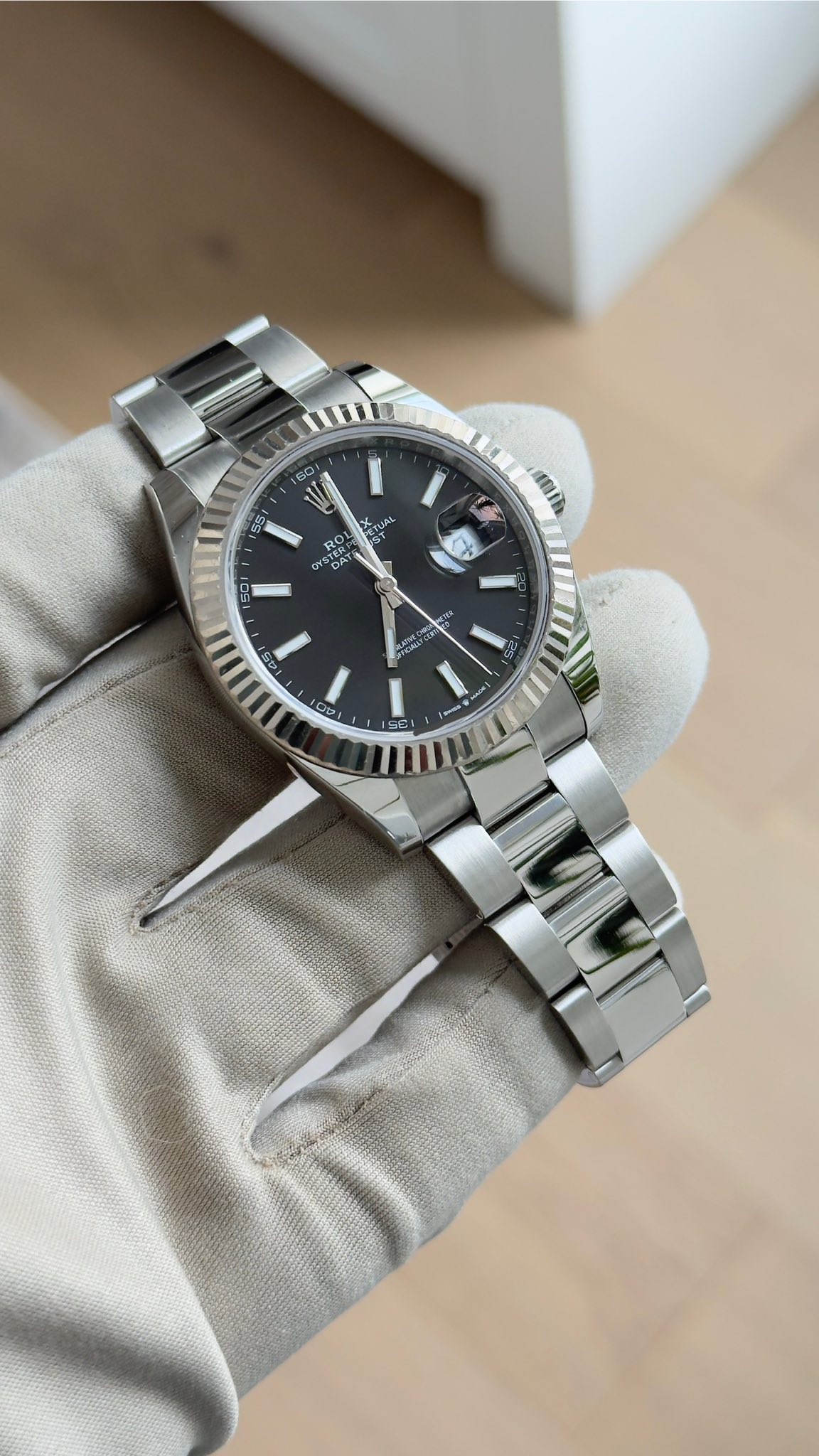 May be an image of wrist watch and text
