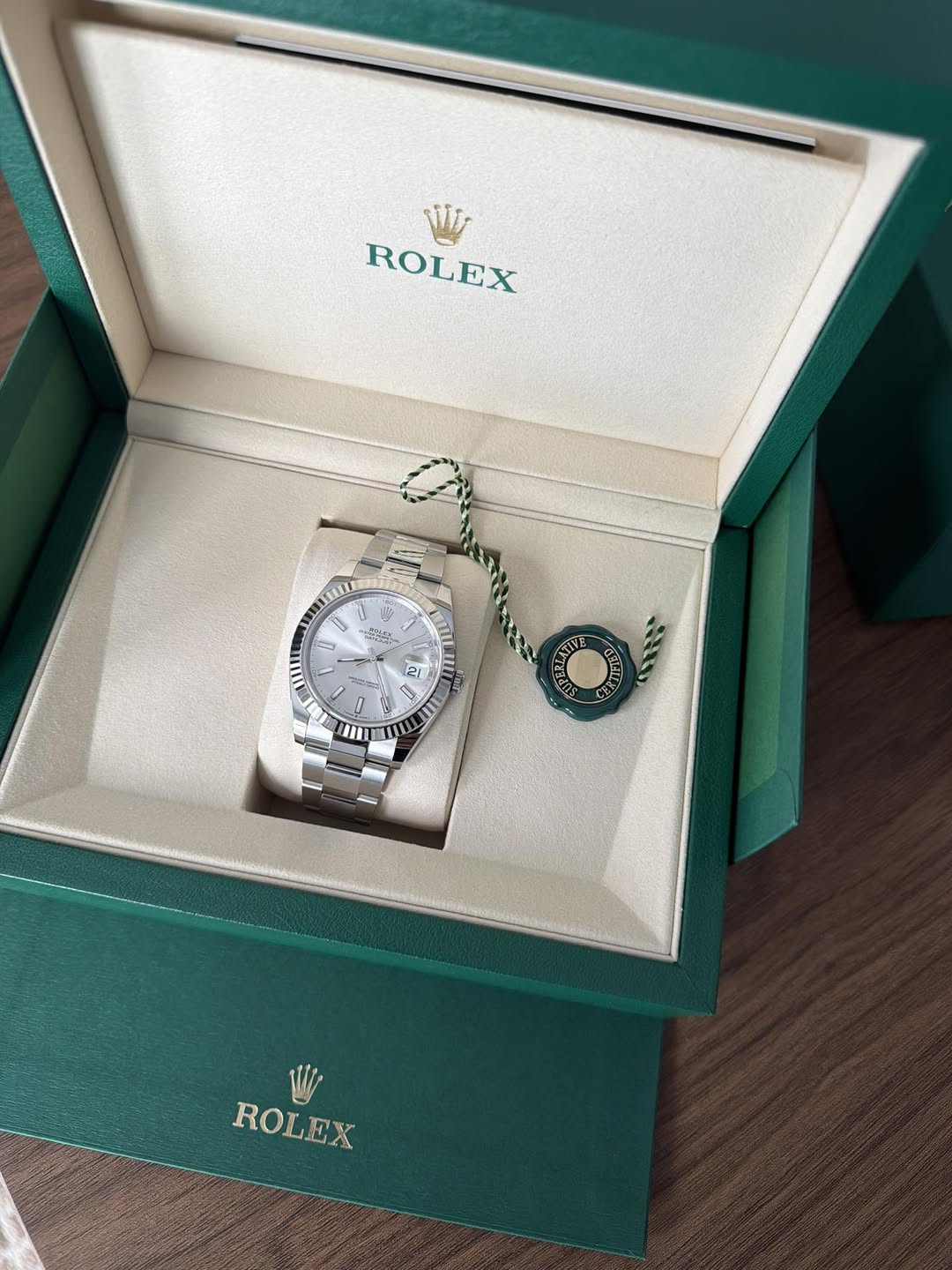 May be an image of wrist watch, jewelry and text