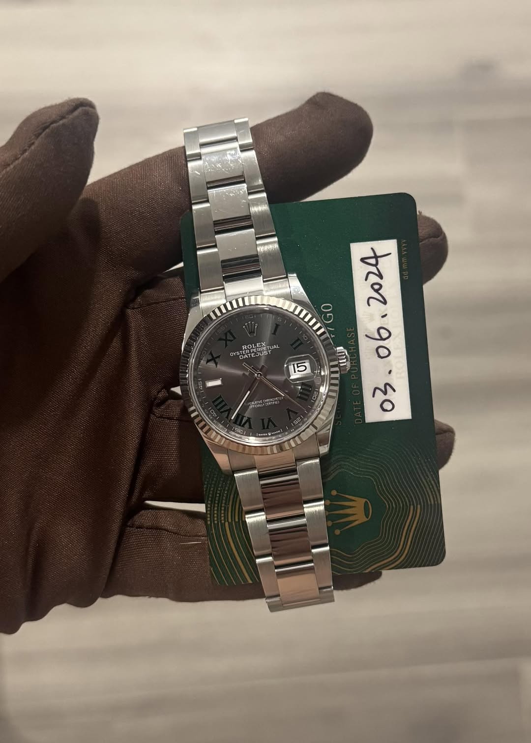 May be an image of wrist watch and text