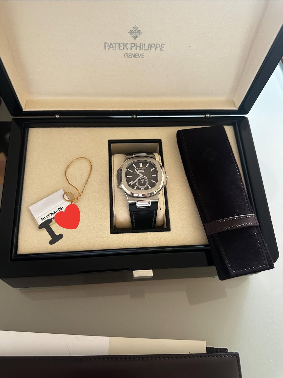 May be an image of wrist watch and text that says 'PATEK PATEKPHI PHILIPPE GENEVE 酒 6 ل መሰራ 5726A.-. 001 Art'