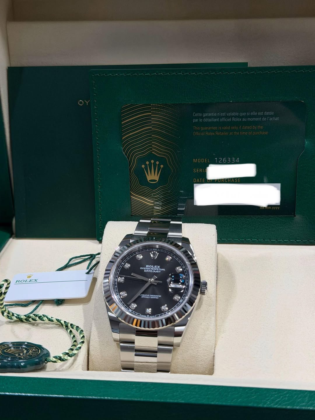 May be an image of wrist watch and text