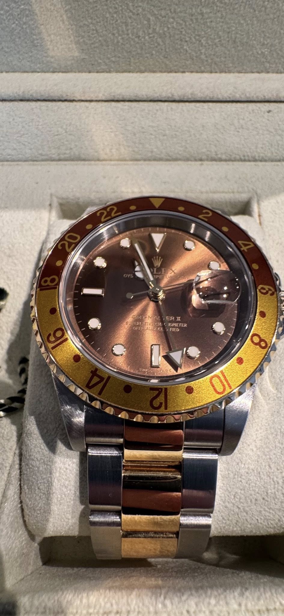 May be an image of wrist watch and text