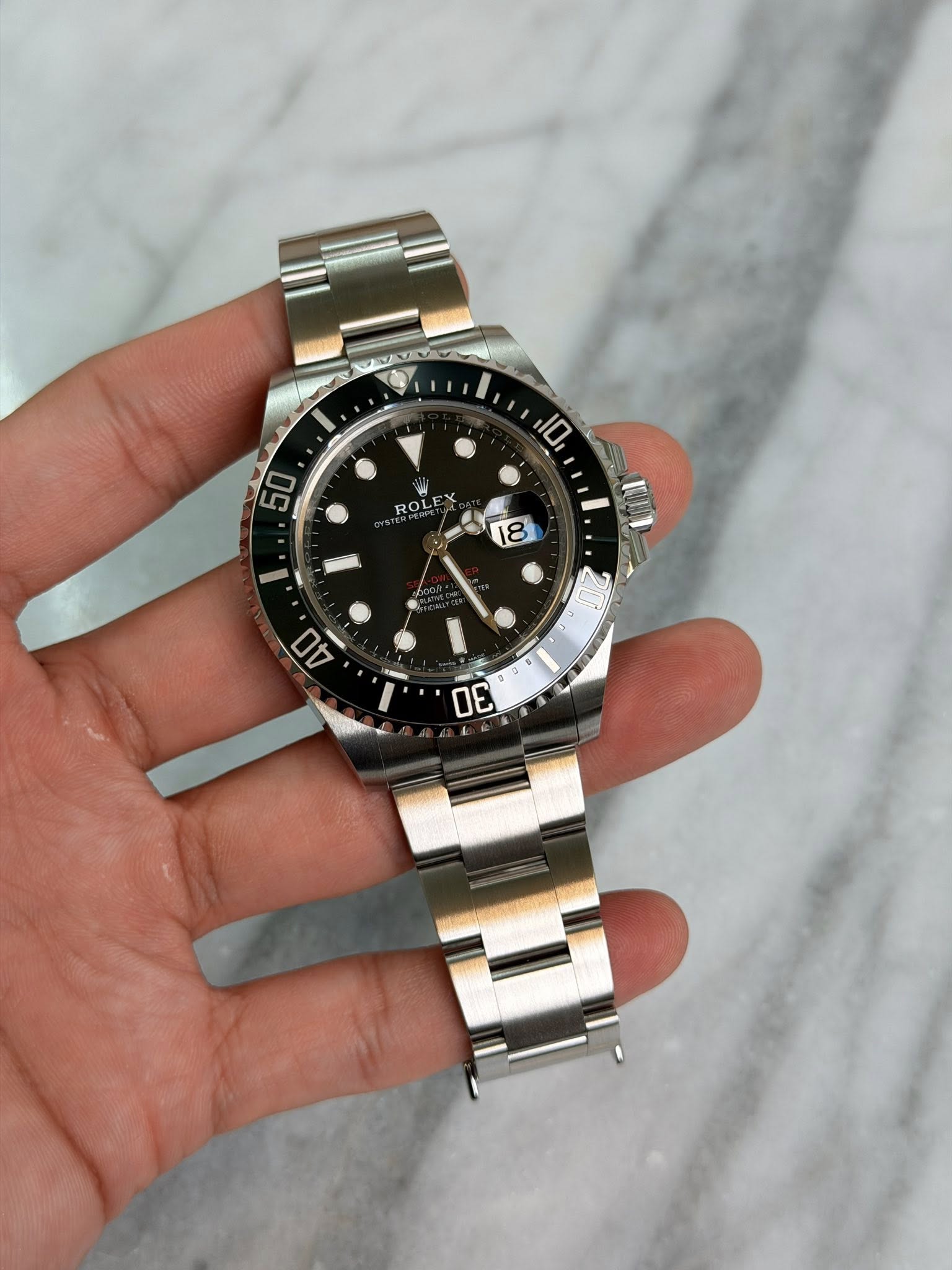 May be an image of wrist watch and text that says '10 50 ROLE 18 D 30'