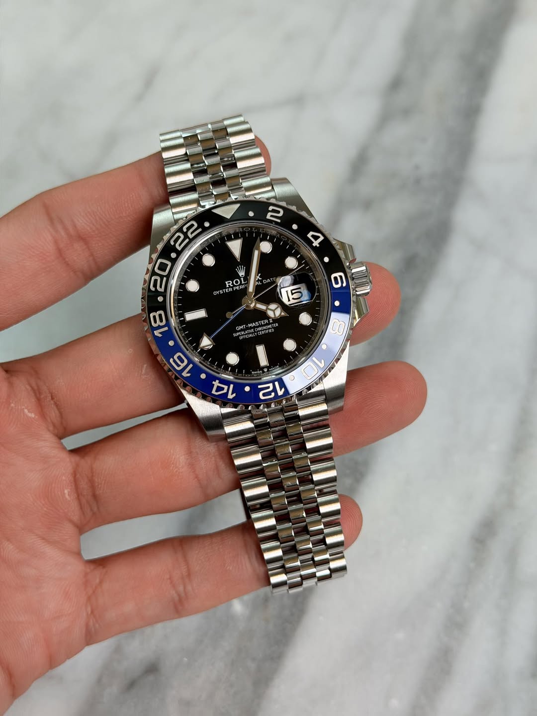 May be an image of wrist watch and text