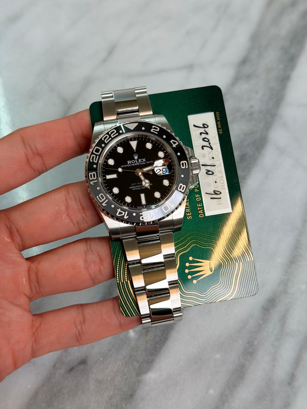 May be an image of wrist watch and text that says '2 ROLEX EX UIA 0 0 8 OF 16 SERIAL DATE על'