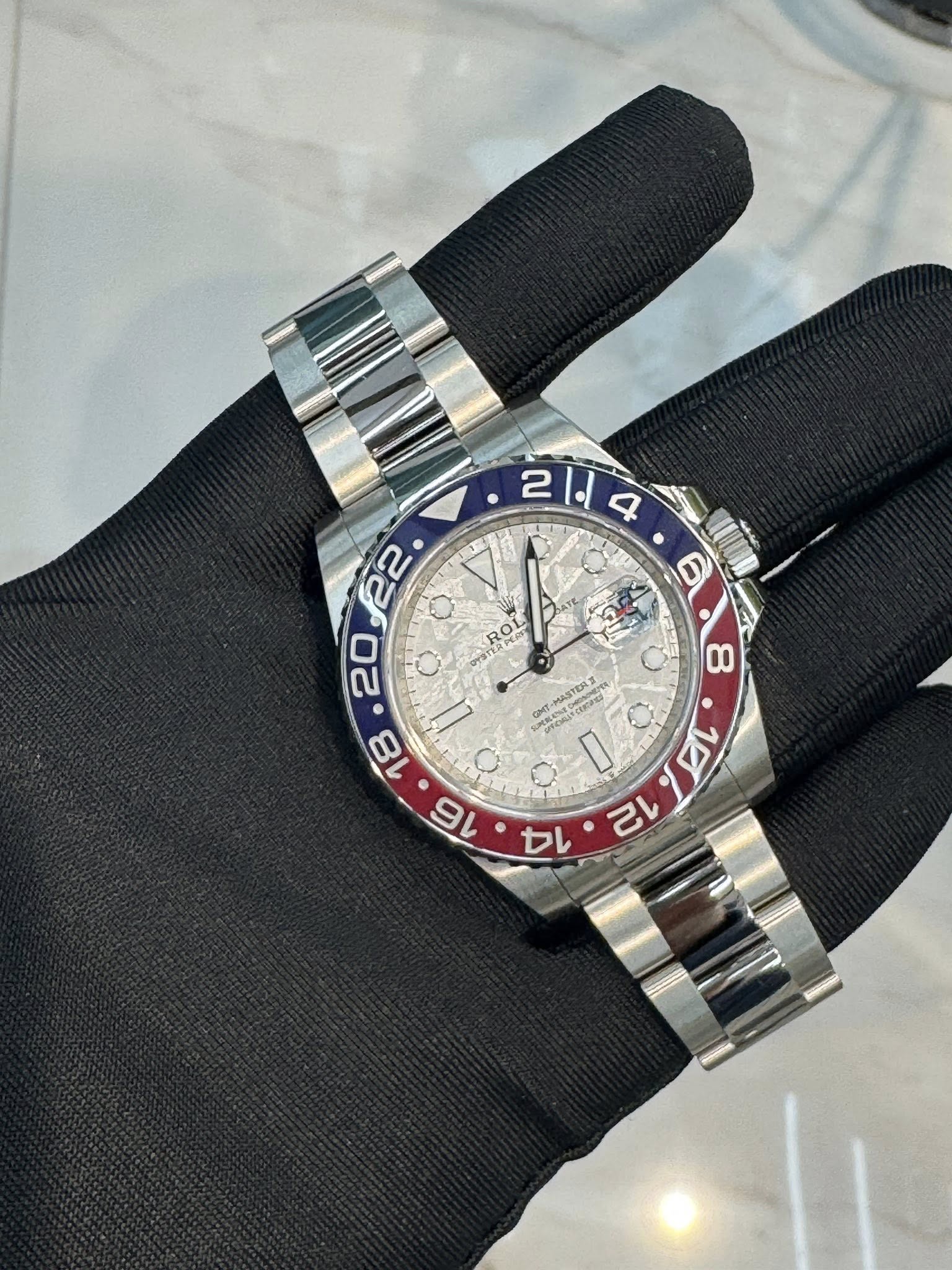 May be an image of wrist watch and text