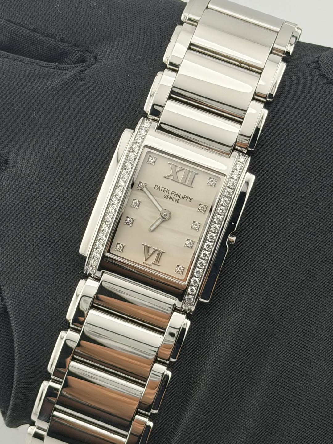 May be an image of jewelry, digital watch and text