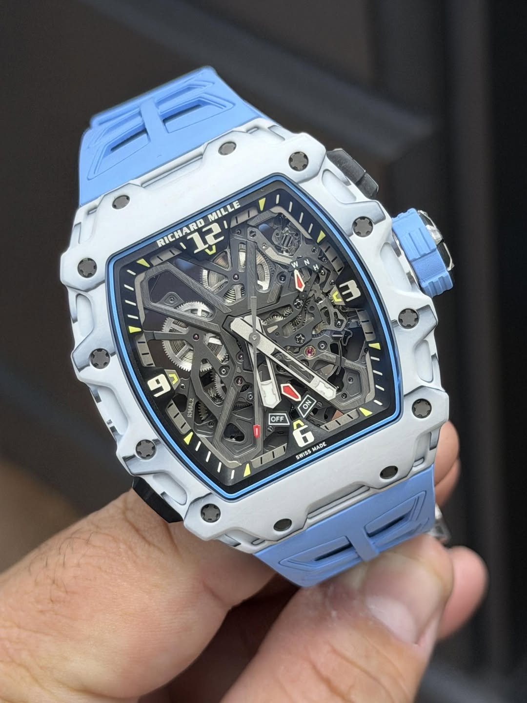 May be an image of wrist watch and text that says 'MILLE RICHARD 12 ااام N11 8 1 m l a 神 I1 ما RMALI ON OFF MADE SWISS'