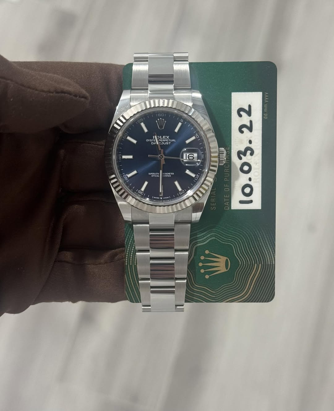 May be an image of wrist watch and text