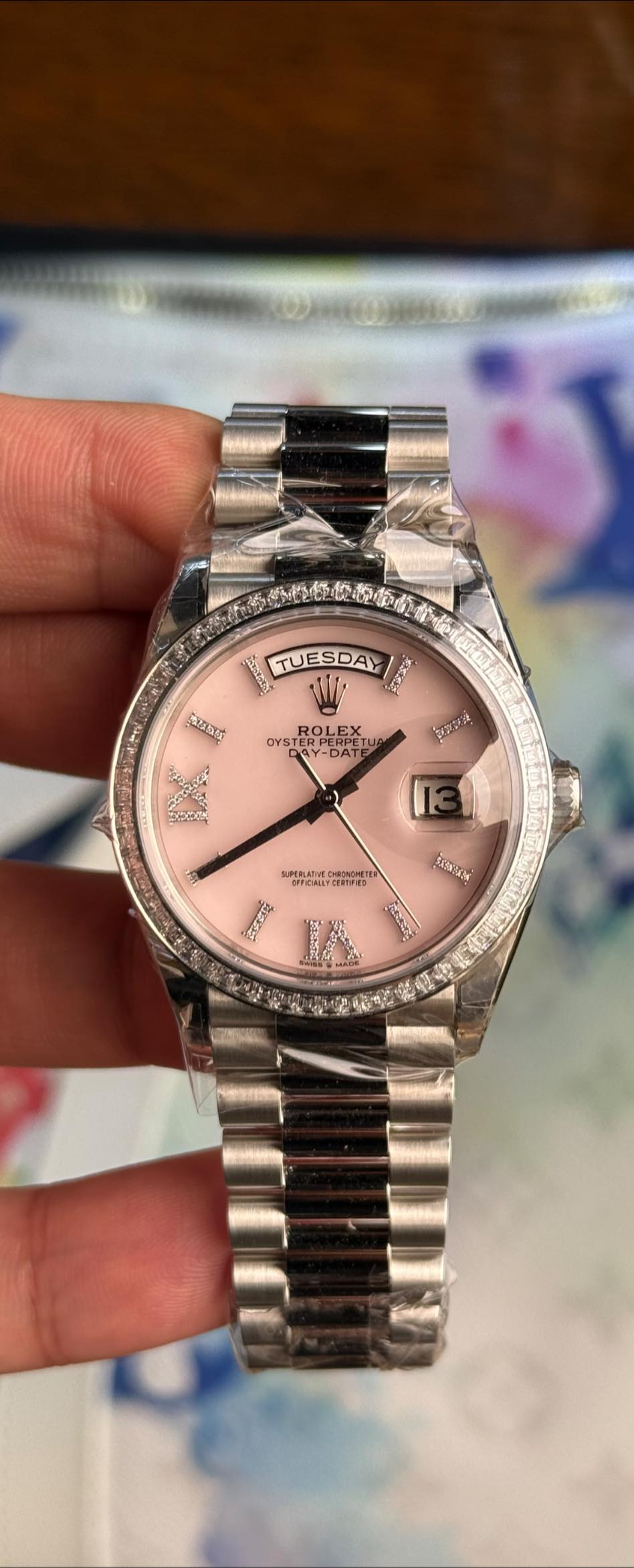 May be an image of wrist watch and text