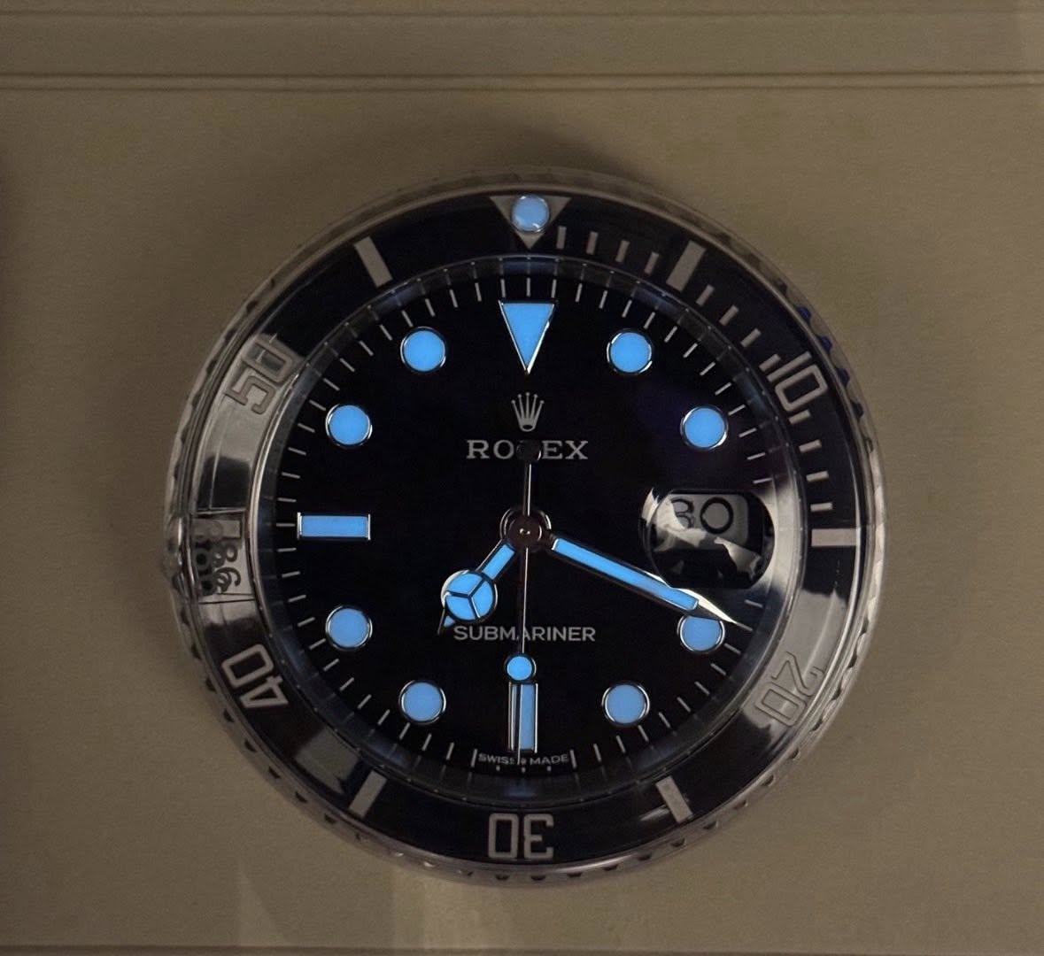 May be an image of wrist watch and text