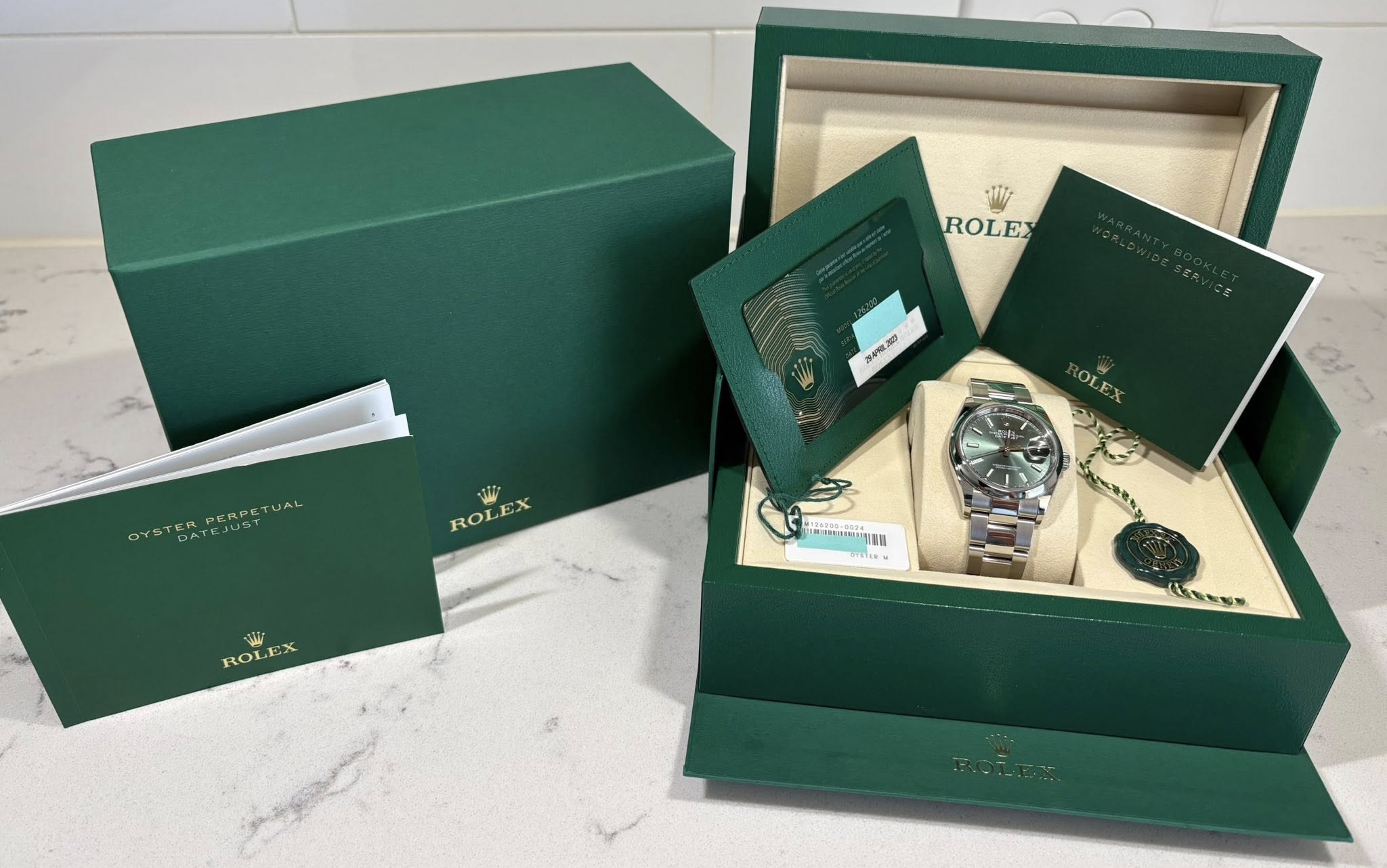May be an image of wrist watch and text