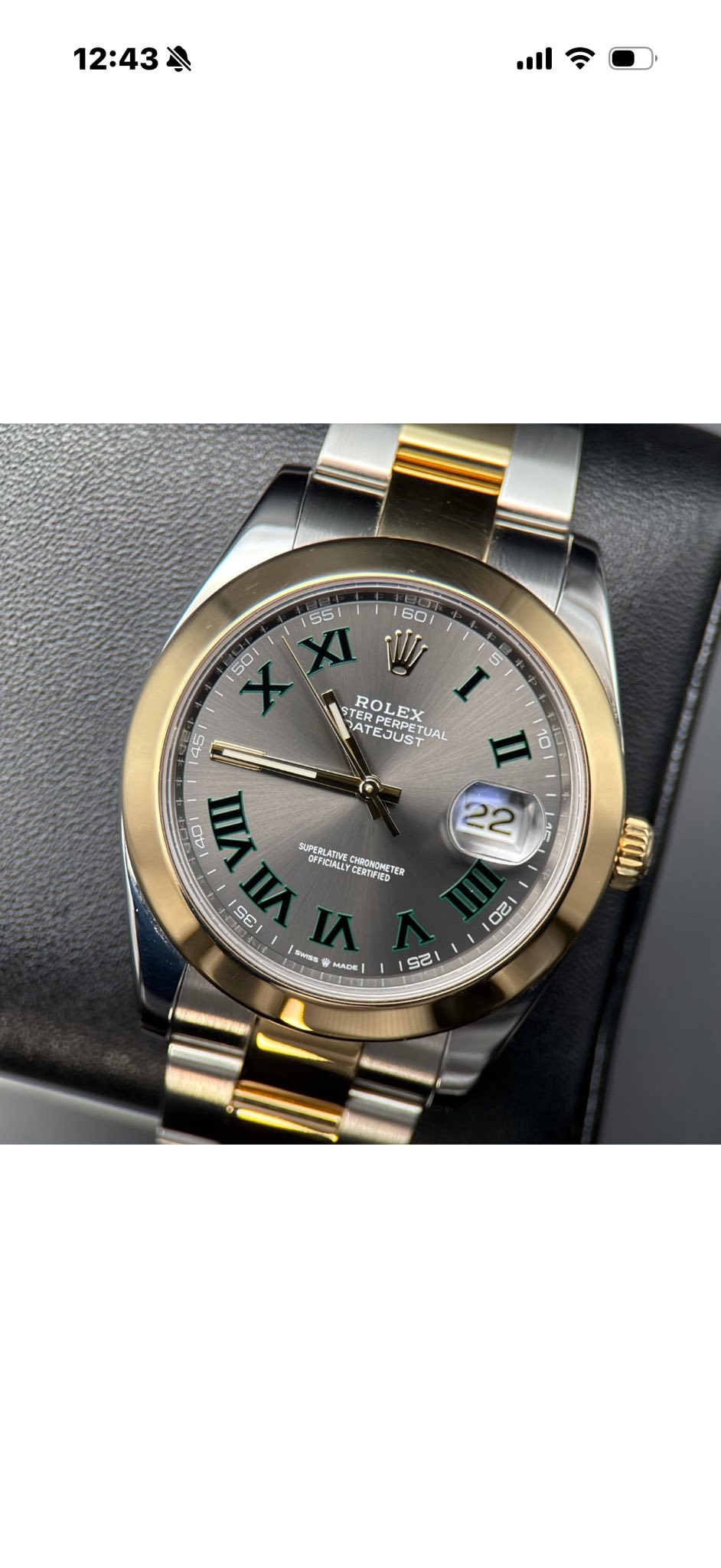 May be an image of wrist watch and text