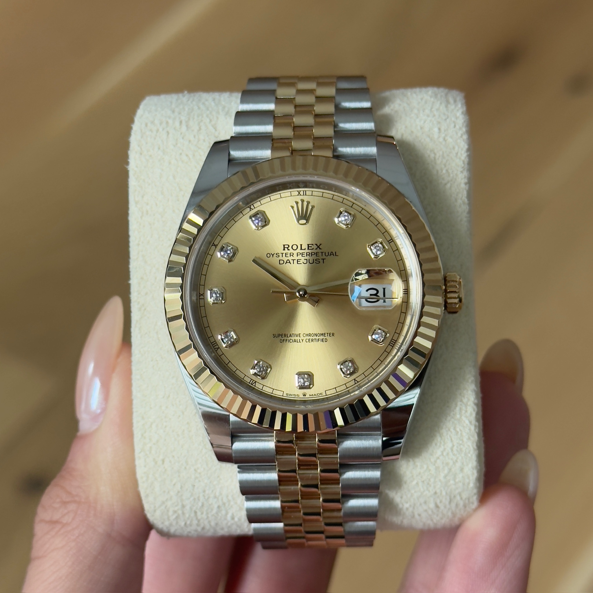 May be an image of wrist watch and text
