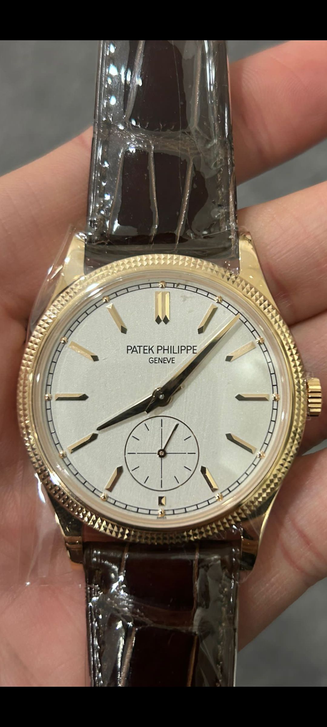 May be an image of wrist watch and text