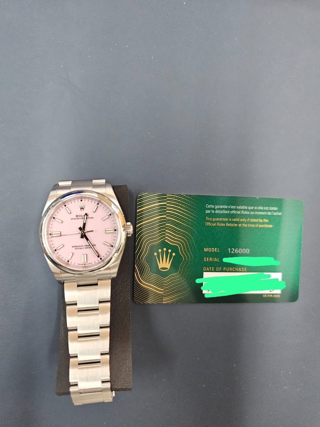 May be an image of wrist watch, money and text