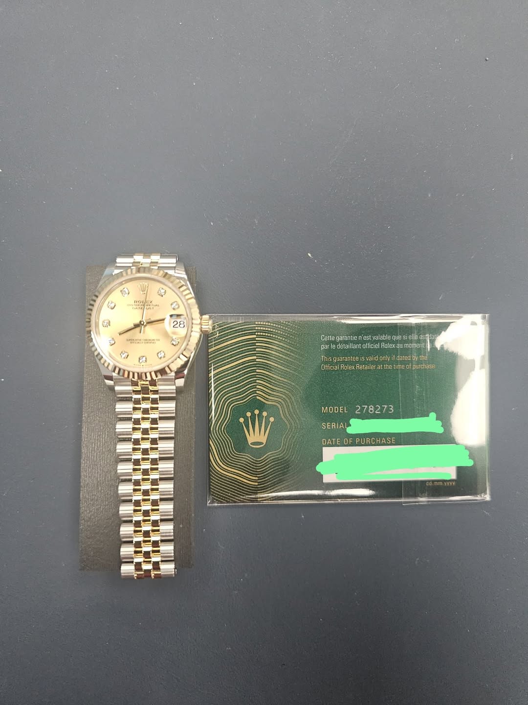 May be an image of wrist watch, money and text