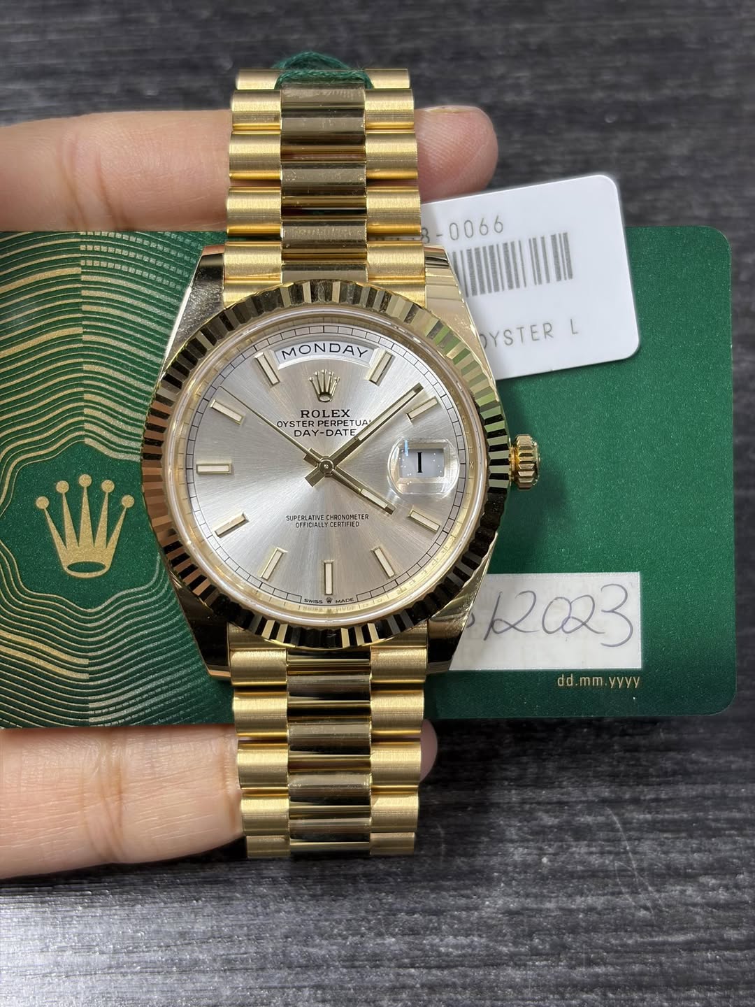 May be an image of wrist watch and text
