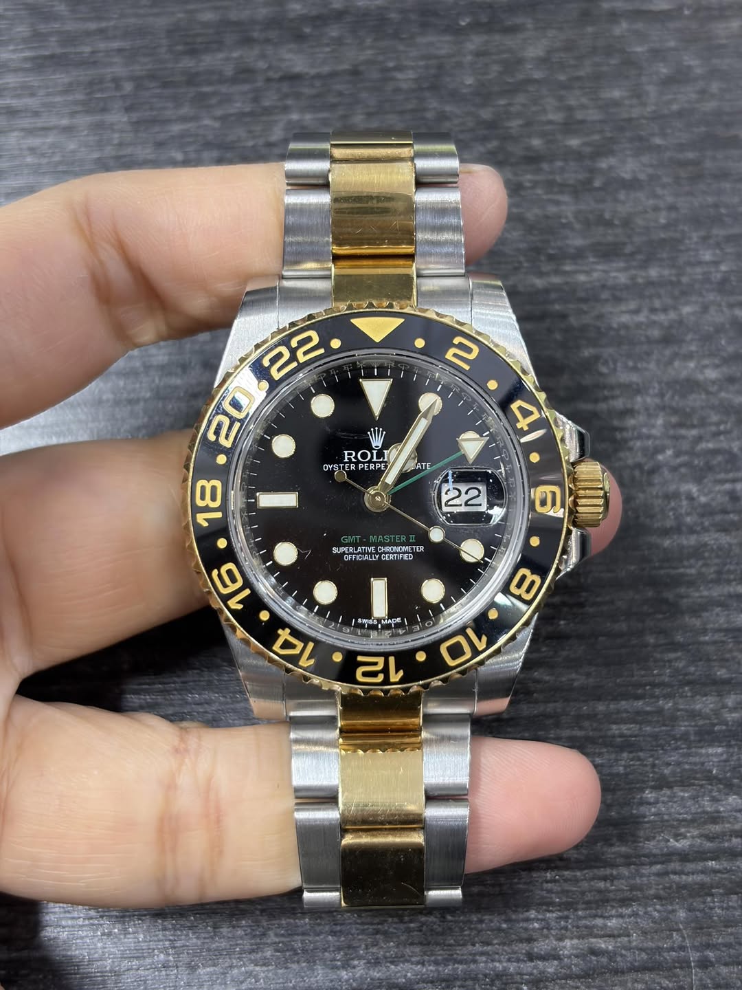 May be an image of wrist watch and text