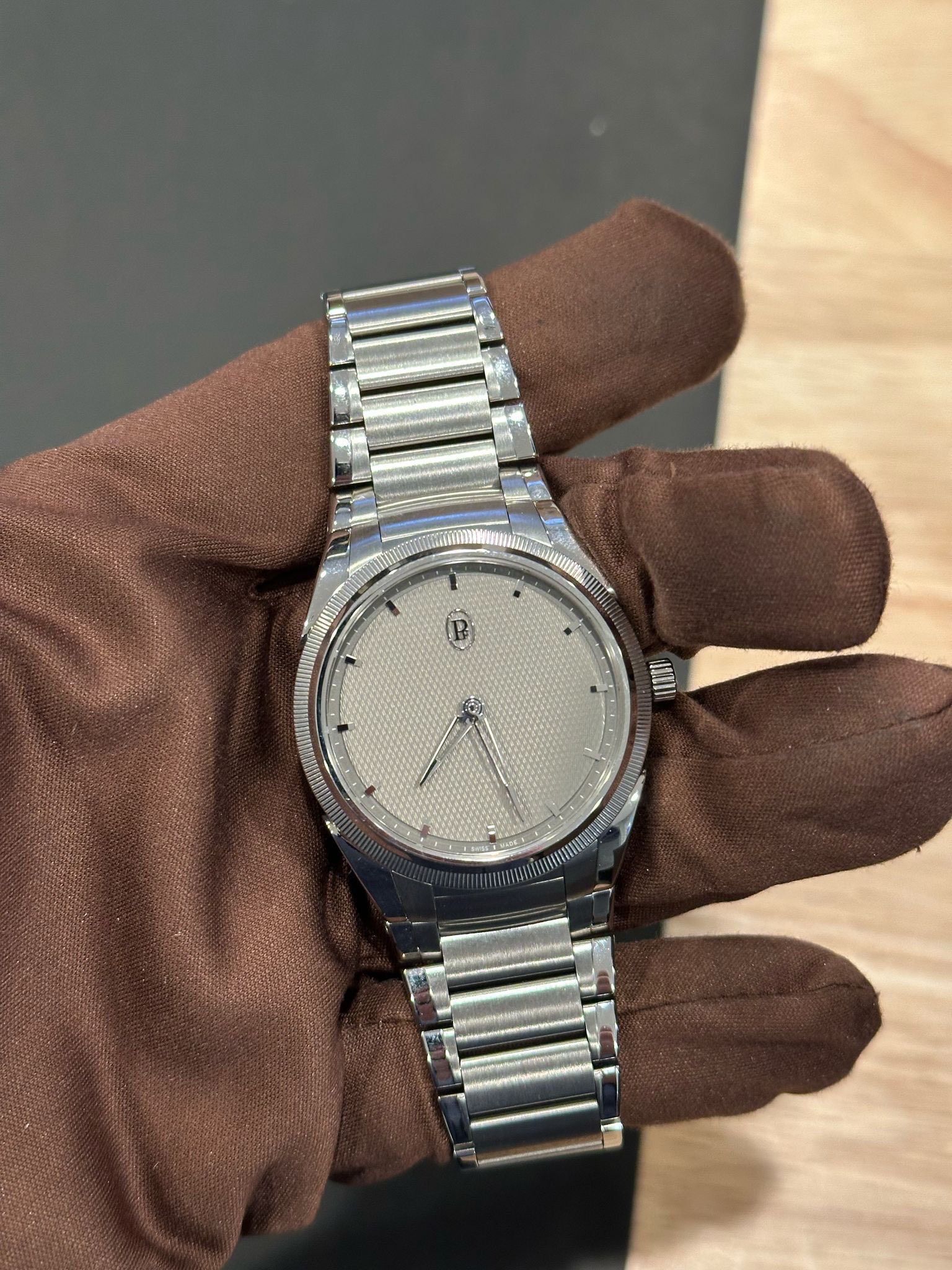 May be an image of wrist watch and text