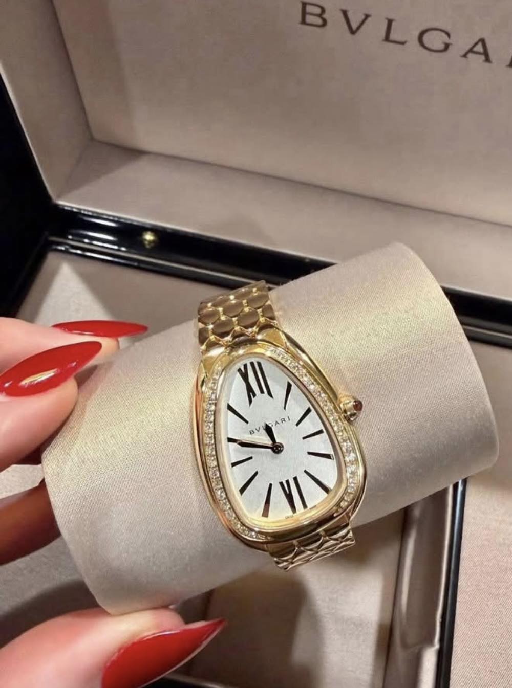 May be an image of wrist watch and text