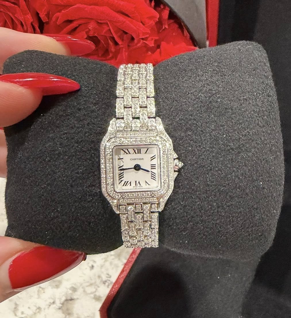 May be an image of wrist watch and text