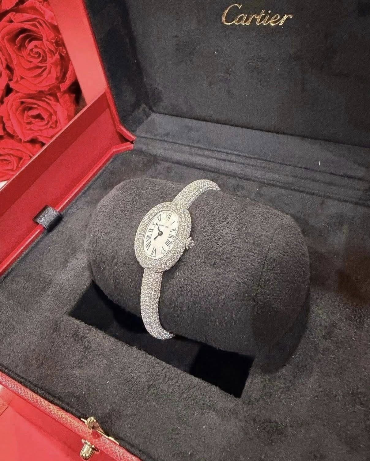 May be an image of wrist watch, ring and text that says 'Cartier IX X PN NO 現'