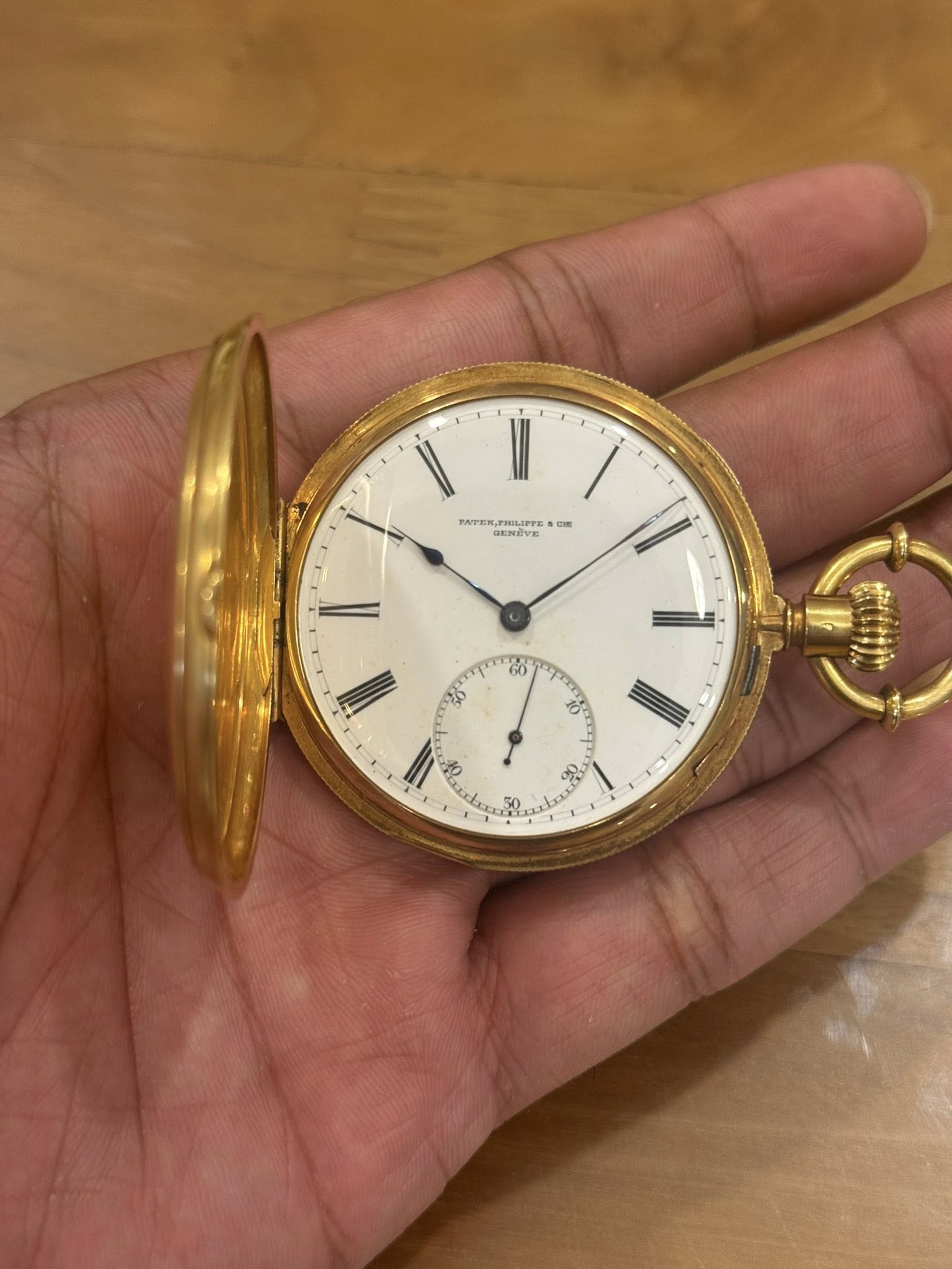 May be an image of wrist watch and text