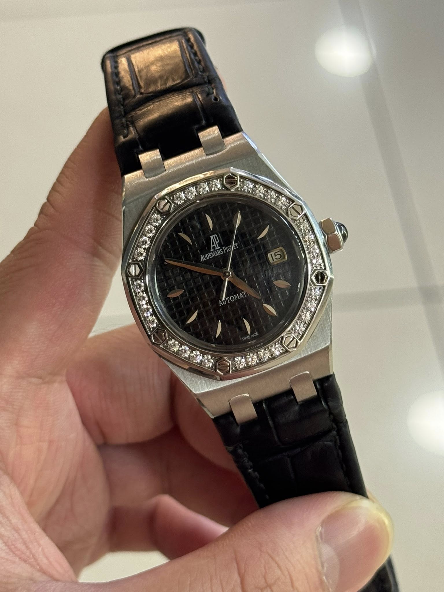 May be an image of wrist watch and text