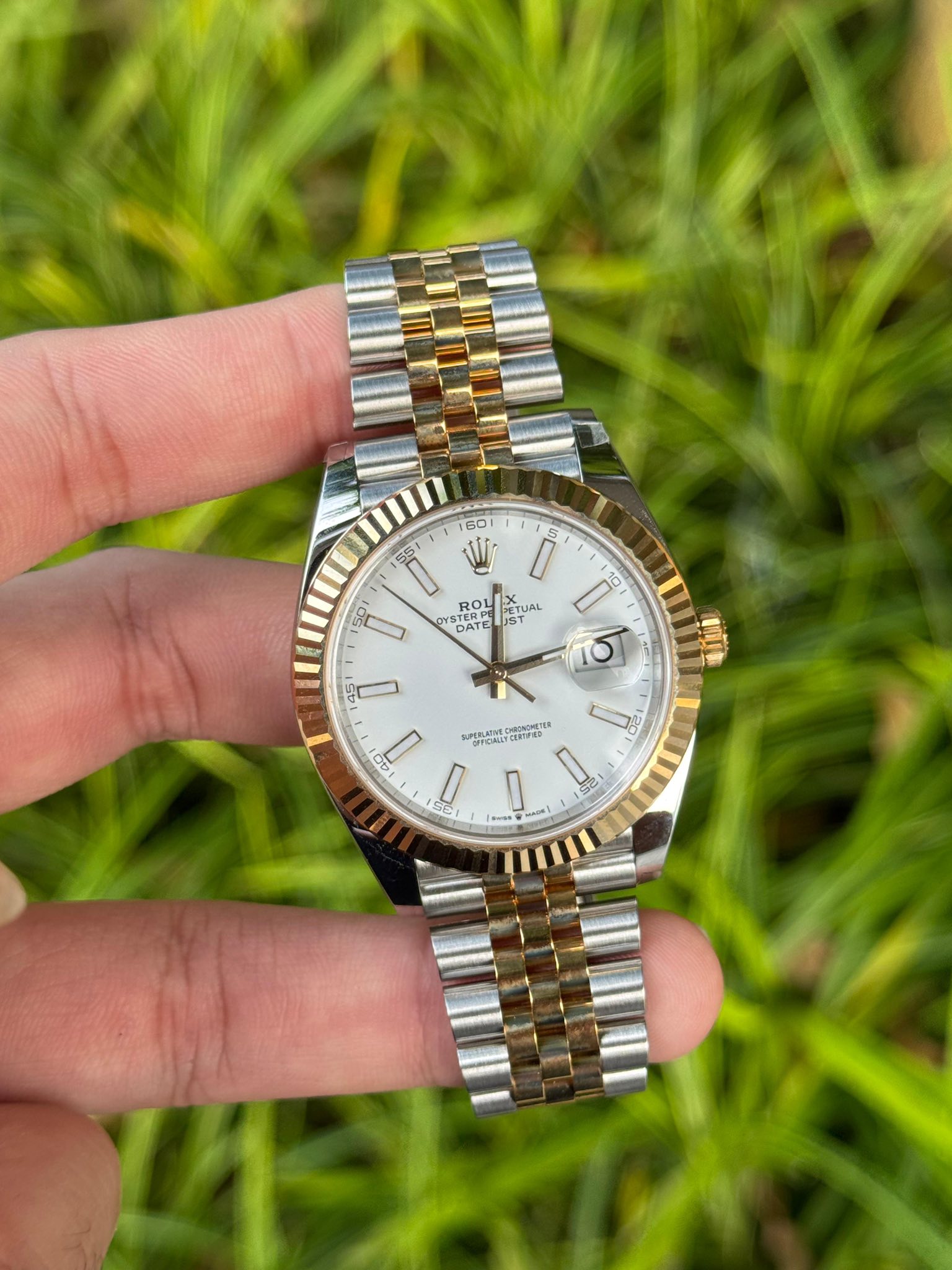May be an image of wrist watch and text