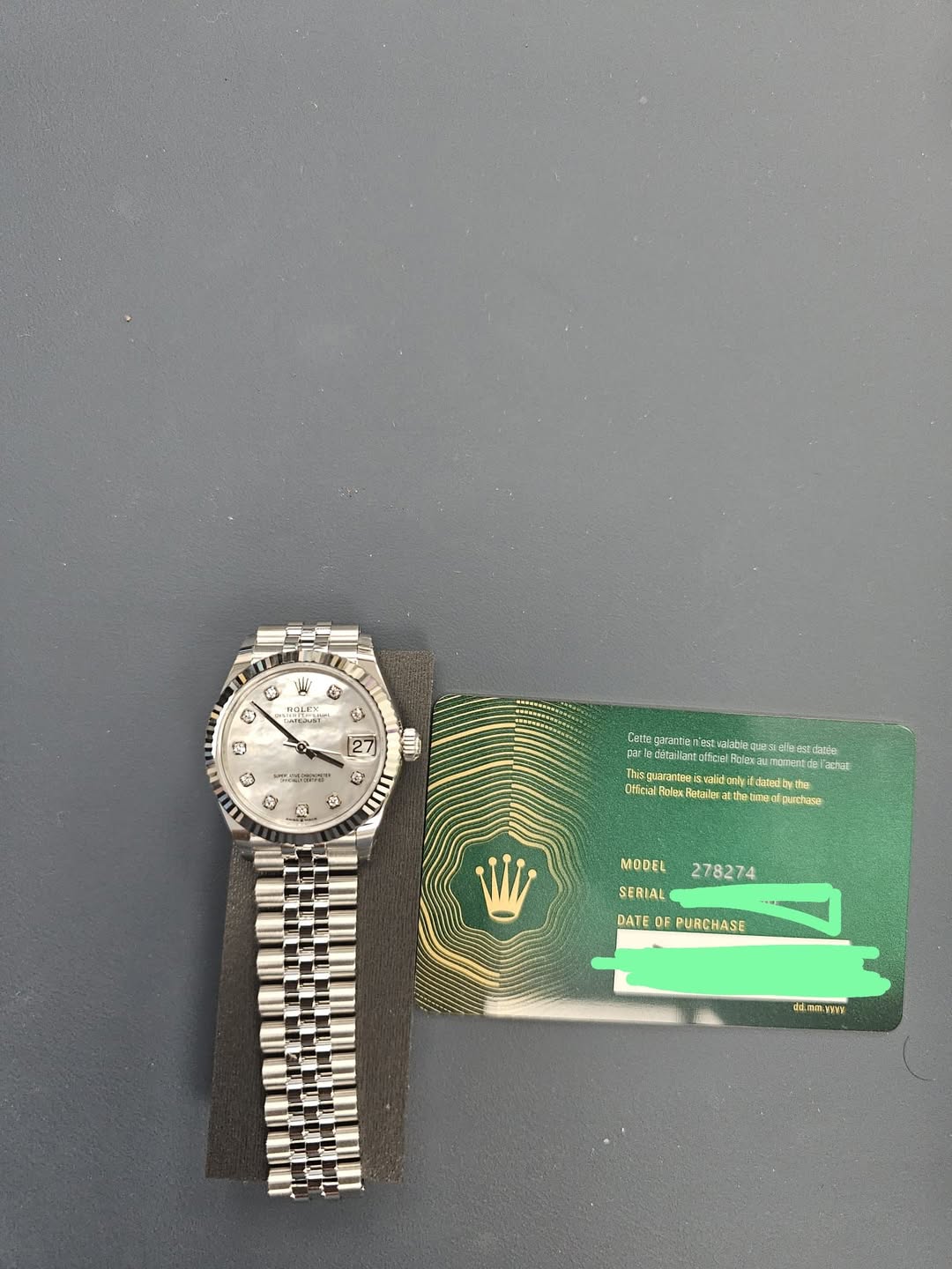 May be an image of ticket stub, wrist watch and text