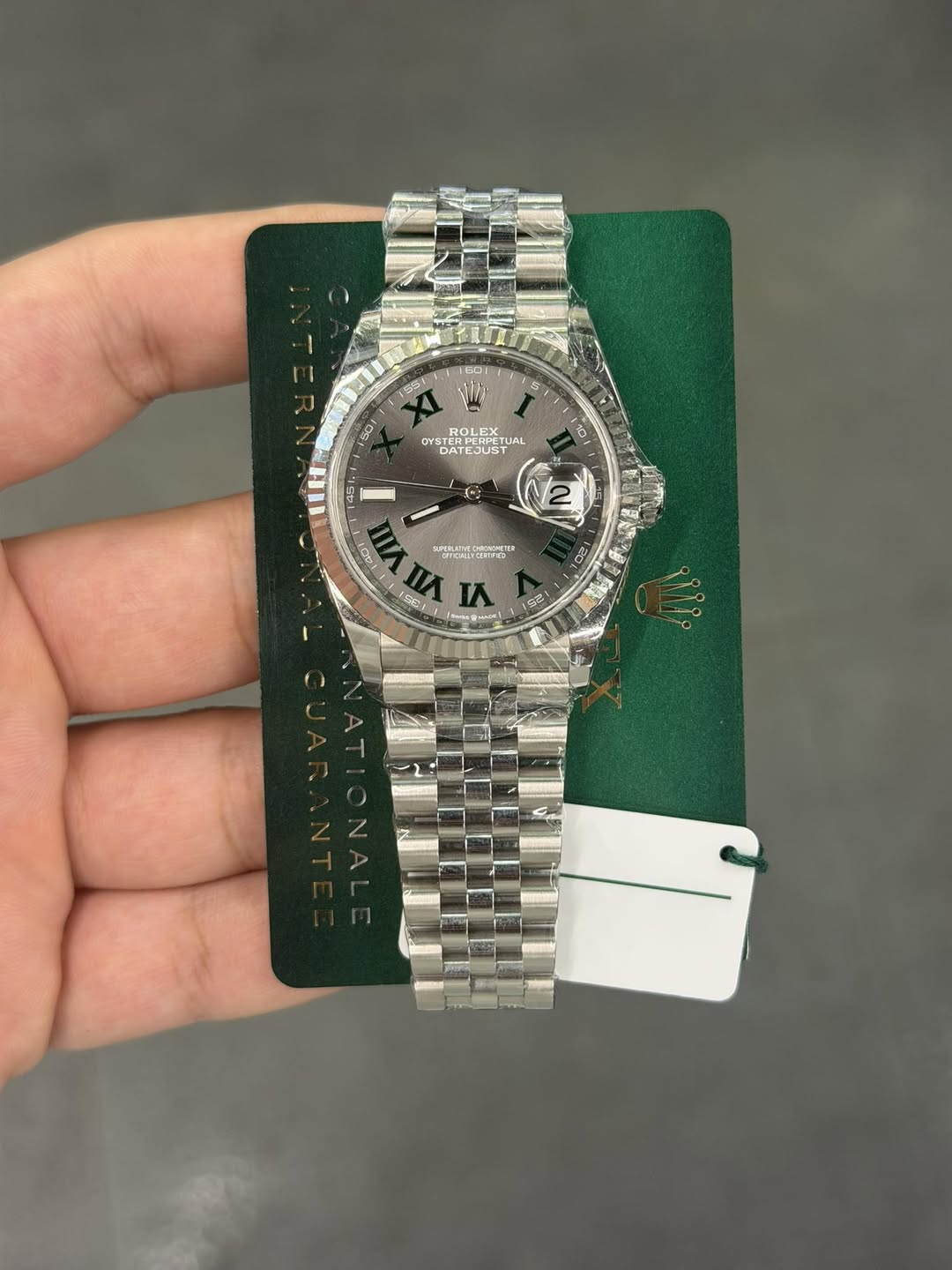 May be an image of wrist watch and text