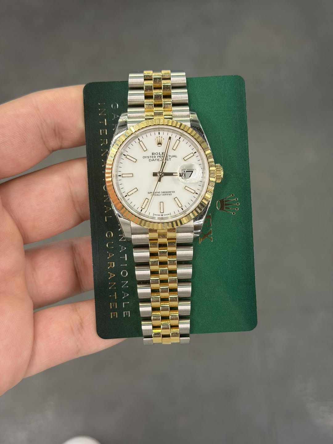 May be an image of wrist watch and text