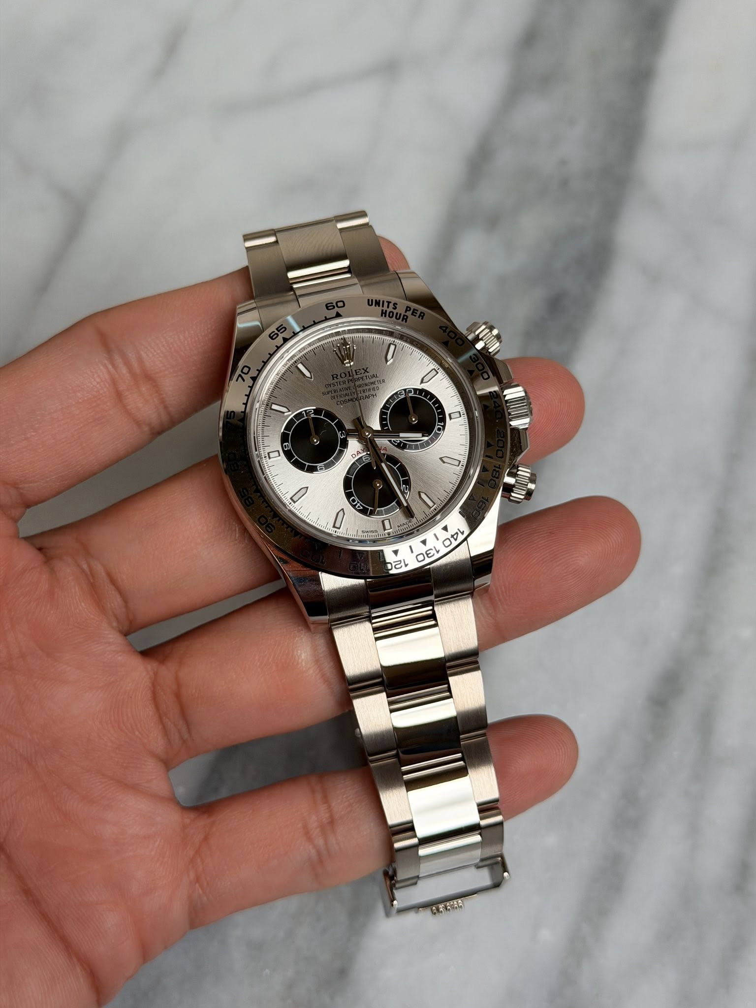 May be an image of wrist watch and text